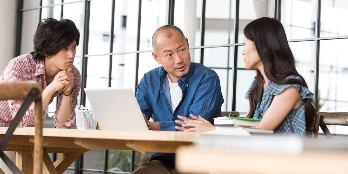 three colleagues having a discussion