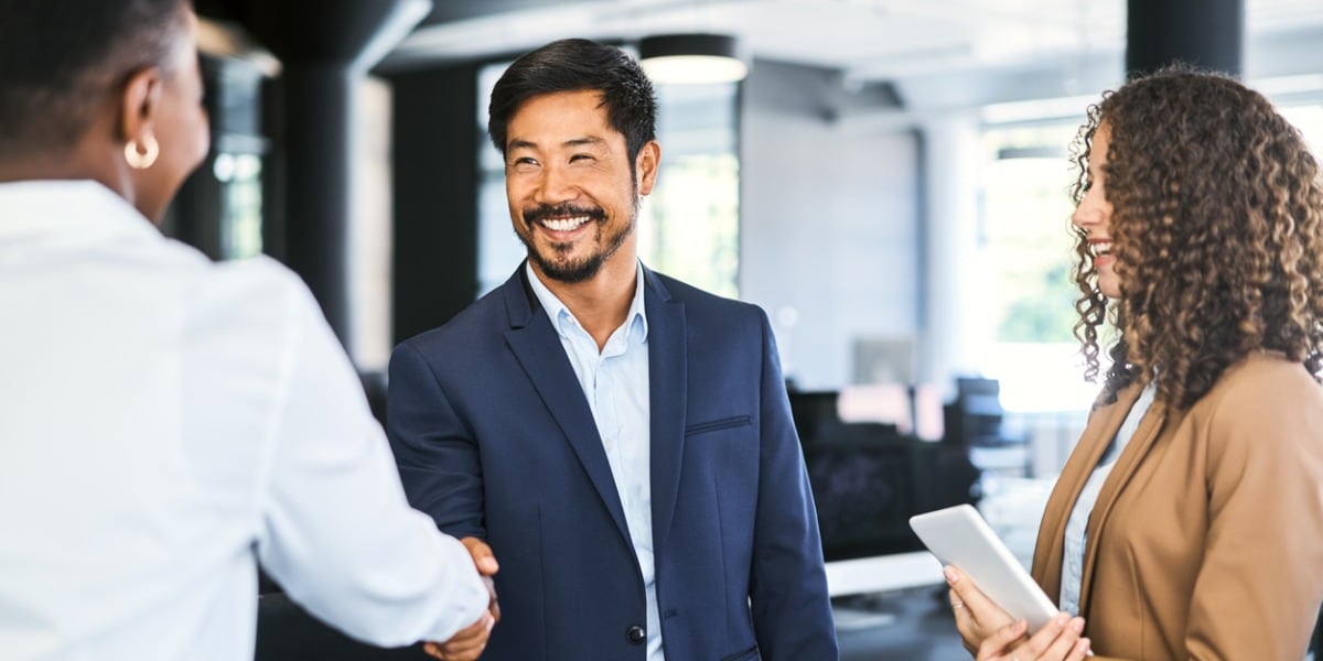 businessman shaking another person's hand