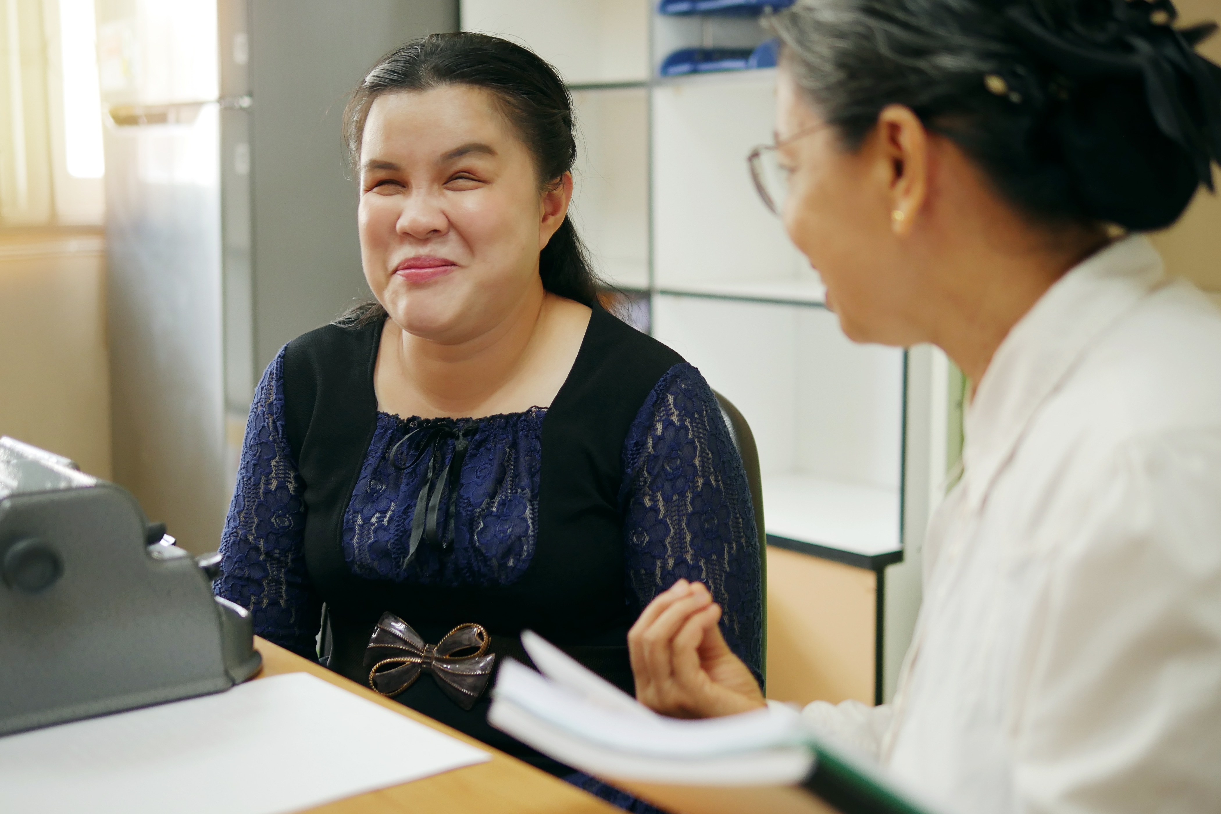 blind asian woman at work