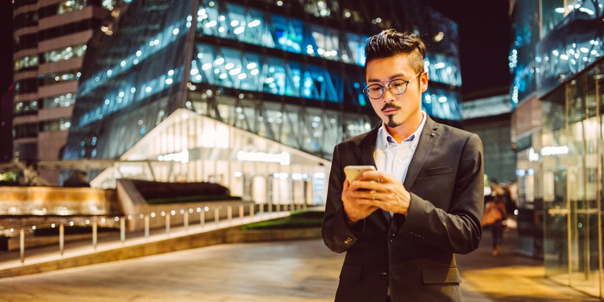 Man standing outside on his phone