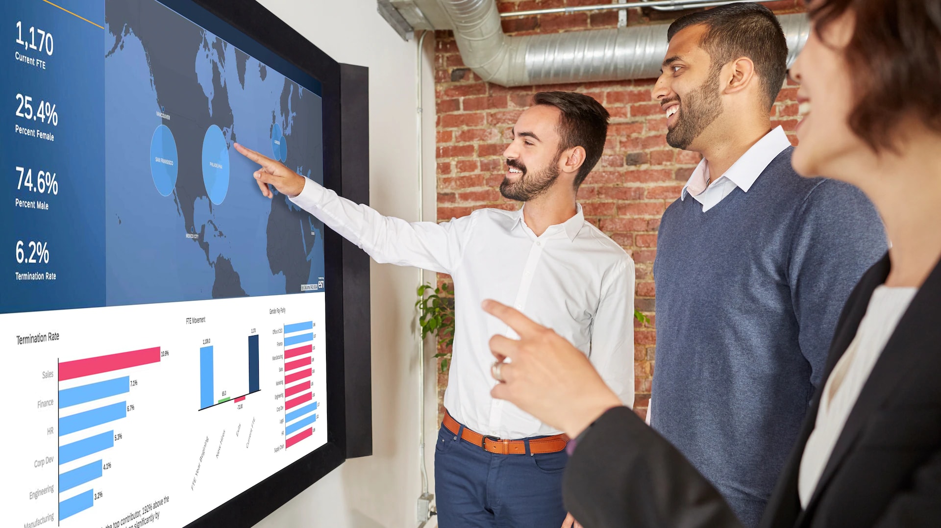 Man pointing at monitor 